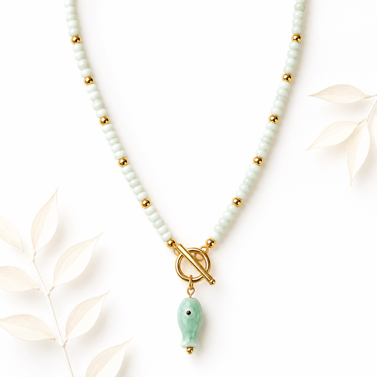 Kralenketting vis mat pastelgroen goud