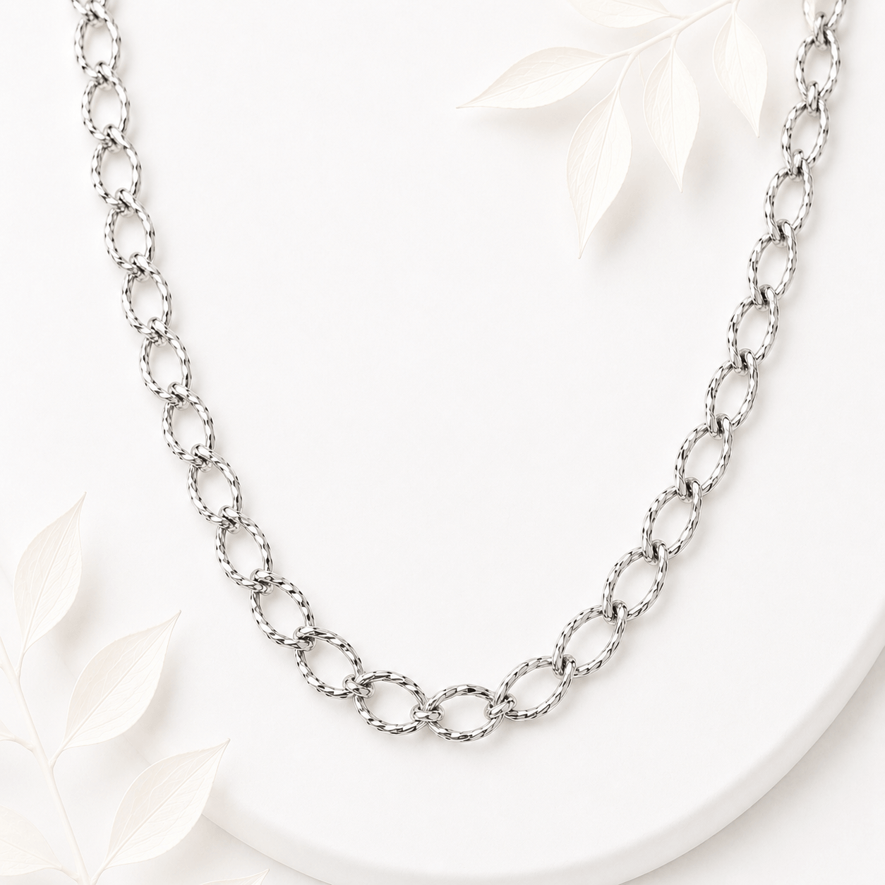 Schakelketting grote ovaal twisted zilver RVS